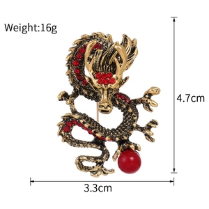 Detailed size specifications for a vintage gold dragon brooch with red crystals