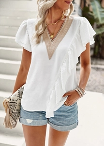 Detail shot of white V-neck short sleeve blouse with delicate lace and ruffle trim accents