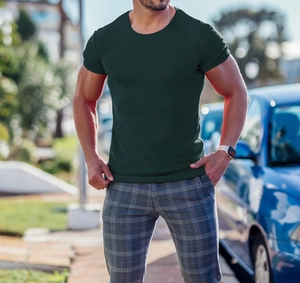 Close-up of men's slim fit dark green ribbed knit T-shirt with textured vertical stripes