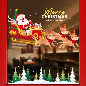 Christmas window stickers featuring Santa Claus on a sleigh with reindeer and snow trees