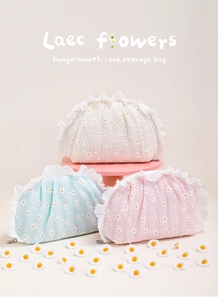 Detailed view of daisy lace pouches in beige, blue, and pink with drawstring closure