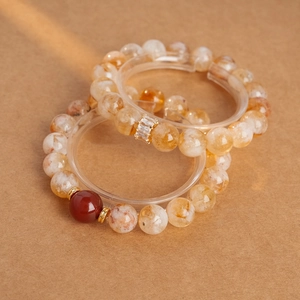 Détails de bracelets en perles de cristal jaune avec agate rouge et accents dorés