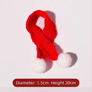 Mini red knit Christmas scarf with white pom-poms measuring 20cm for holiday decor