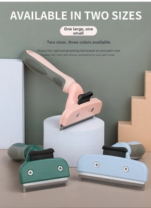 Detail of pet grooming comb featuring ergonomic handle and dense metal teeth in two sizes