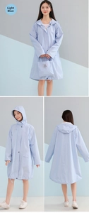 Detail of light blue waterproof raincoat featuring a drawstring hood and matching storage bag