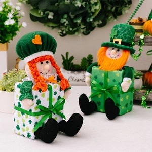 Detailed view of Saint Patrick's Day gnome dolls on shamrock gift boxes with green hats