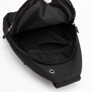 Black Oxford cloth sling bag with internal zipper pocket and external headphone port