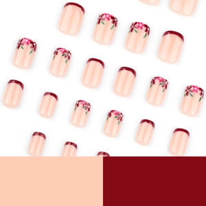 Short square press on nails set with red French tips and delicate pink flower patterns