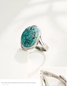 Close-up of S925 sterling silver hallmark on oval turquoise ring with adjustable band