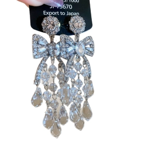 Sparkling silver butterfly tassel earrings with crystal fringe and teardrop pendants