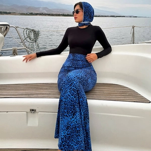 Close-up of blue leopard print maxi skirt and matching headscarf on a luxury yacht