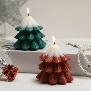 Green and red Christmas tree scented candles with snow design for holiday home decoration
