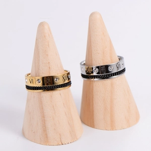 Hollow Roman numeral ring with crystal inlay on a wooden display stand for showcase