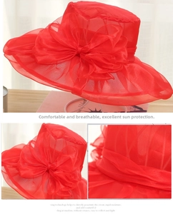 Detail of red organza sun hat featuring an elegant oversized bow and breathable mesh fabric