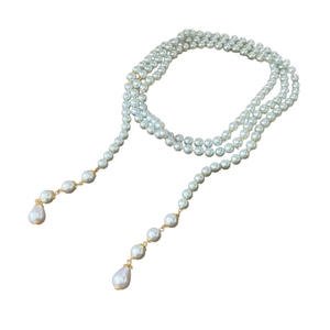 Elegant multi-layer long pearl necklace with golden clasp and teardrop pendant
