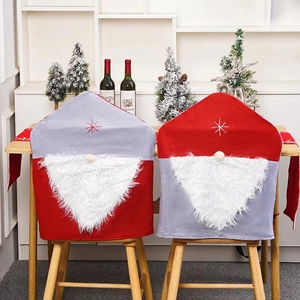 Christmas Santa hat chair covers with gnome design for festive dining room decoration