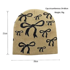 Khaki knit beanie with black bow jacquard, 21cm height, 20cm width, size 54-60cm