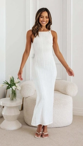 Detail shot of white wavy pleated texture on a backless bodycon maxi dress for women