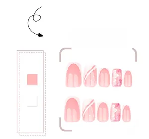 Detail of pink glitter press-on nails with white floral patterns and French tips