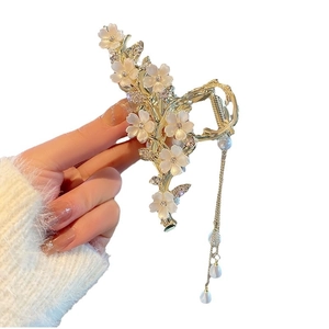 Elegant gold flower hair claw clip with white blossoms and long pearl tassel chains