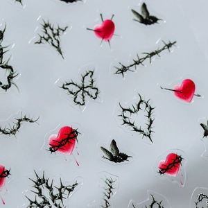 Gothic butterfly and thorn nail stickers with red hearts and black barbed wire designs