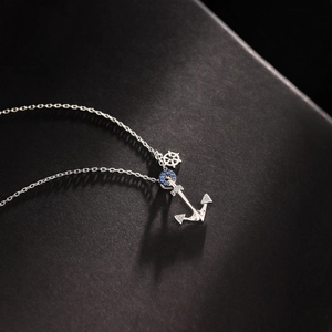 Marine style S925 silver necklace with anchor and helm pendants featuring blue zircons