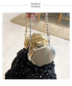 Close-up of gold and silver octagonal metal evening bags with beaded chain handles