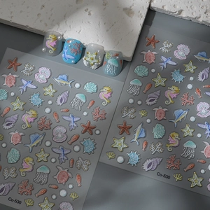 Detail of 3D embossed ocean nail stickers with sea horse, starfish and shell patterns