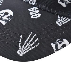 Detailed macro view of white skull and BOO prints on black twill cotton baseball cap