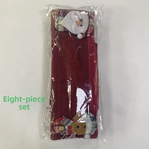 8-piece Christmas handle covers set with Santa and reindeer plush patches on red fabric