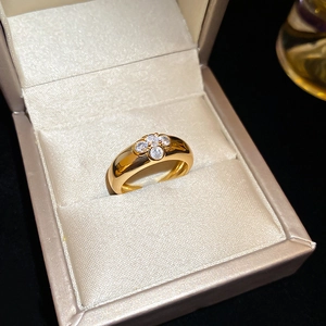 Detail of vintage gold flower ring with sparkling zircon stones in a jewelry box