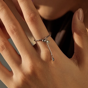 S925 sterling silver adjustable chain ring with spherical pendant worn on finger