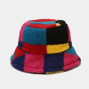 Close-up of colorful patchwork lamb wool bucket hat with thick plush texture