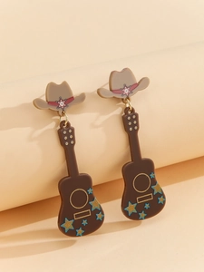 Detailed close-up of creative cowboy hat and guitar shaped drop earrings in brown acrylic