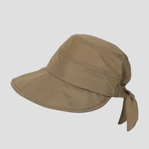 Detail view of khaki sun hat featuring wide brim, decorative bow, and fine stitching