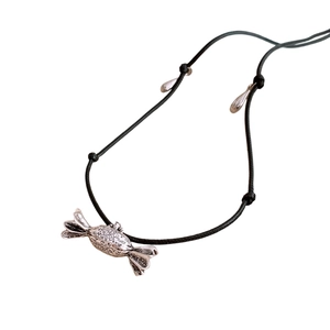 Adjustable black leather cord necklace featuring a vintage silver candy pendant