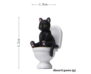 Miniature black cat figurine on toilet detail showing 4.2cm height and 1.8cm width