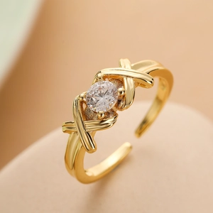 Crossed lines gold plated open ring featuring a sparkling round zircon stone inlay