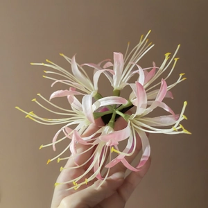 Detail of pink gradient Lycoris flower hair clip with wave-shaped petals and stamens