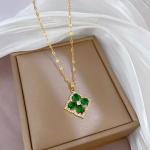 Luxury gold-plated four-leaf clover necklace with green stone and micro-pave crystals