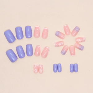 French press-on nails set with purple glitter, butterfly motifs and pink base tips