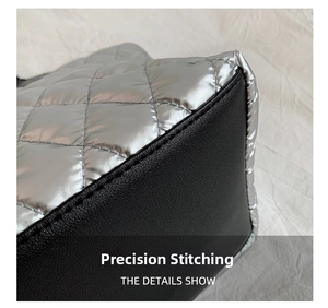 Detail showing silver quilted metallic fabric with black stitching and material contrast