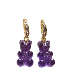 Translucent purple gummy bear earrings with gold hoops and sparkling zircon stones