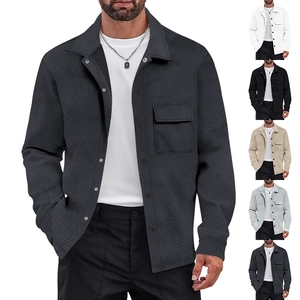 Detail of heavyweight twill texture on a vintage long-sleeve knit shirt jacket with chest pocket
