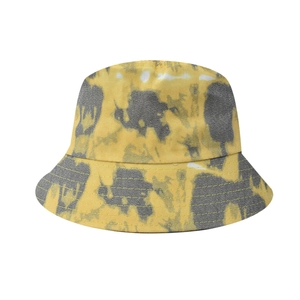 Detailed close-up of yellow and gray tie-dye bucket hat with reinforced stitching on brim