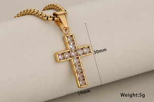 Gold cross pendant with cubic zirconia stones measuring 30mm by 19mm and weighing 5g