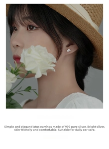 Detailed close-up of s999 sterling silver lotus stud earrings worn on model's ear lobe
