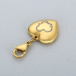 Polished gold heart keychain pendant with engraved patterns and lobster clasp closure