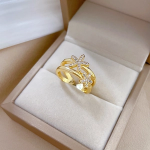 Gold plated double starfish open ring with sparkling crystals on jewelry display