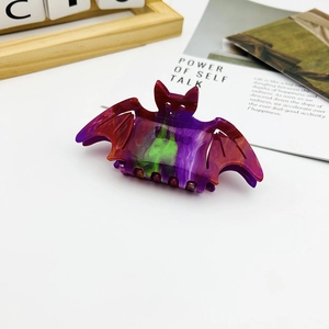 Halloween bat-shaped hair claw clip with colorful marbled pattern acetate finish